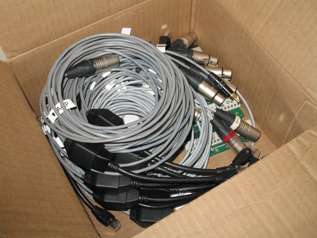 Box full of audio cables